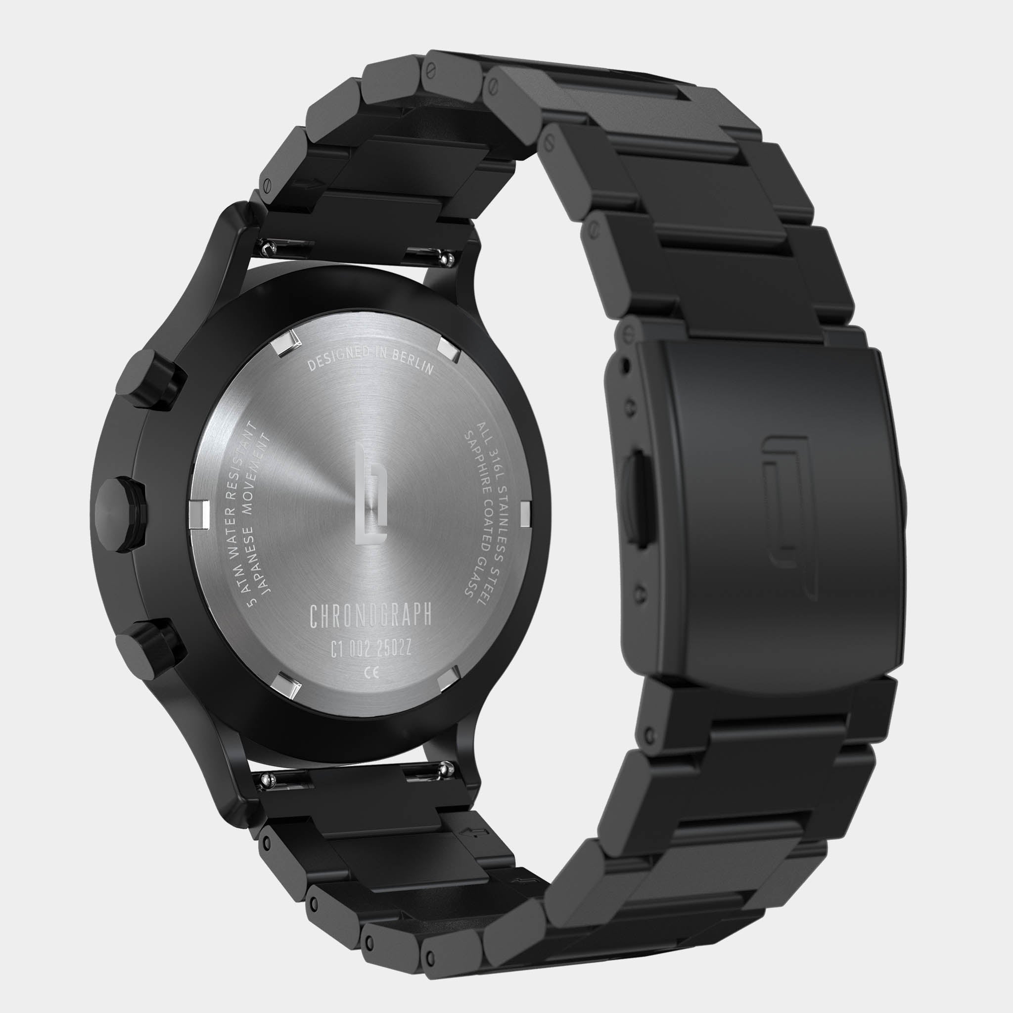 Back view of a black stainless steel chronograph watch with engraved case and metal bracelet