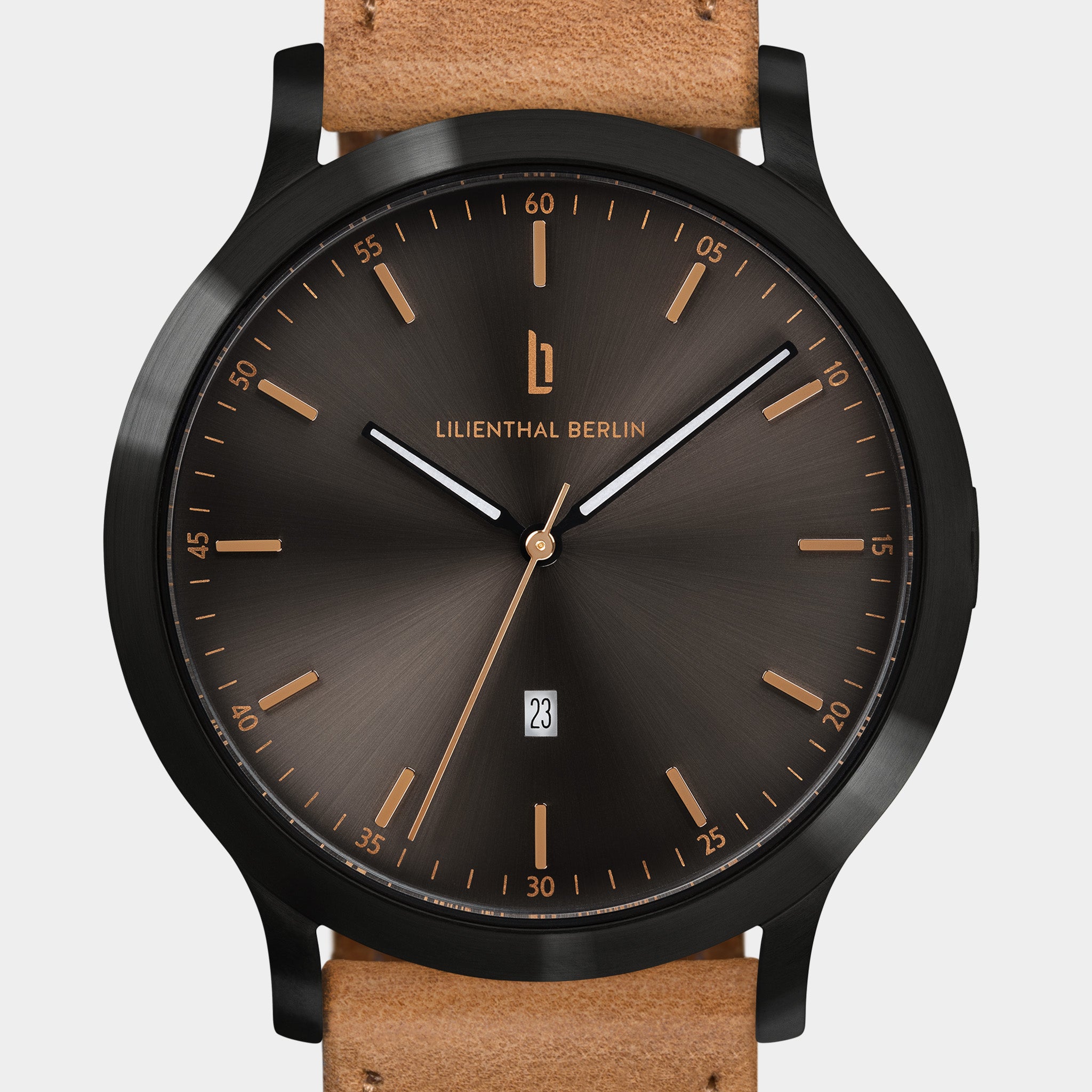 Brown sunburst dial wristwatch with date display and tan leather strap.