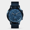 Blue chronograph watch with mesh strap, modern dial, and visible date display.