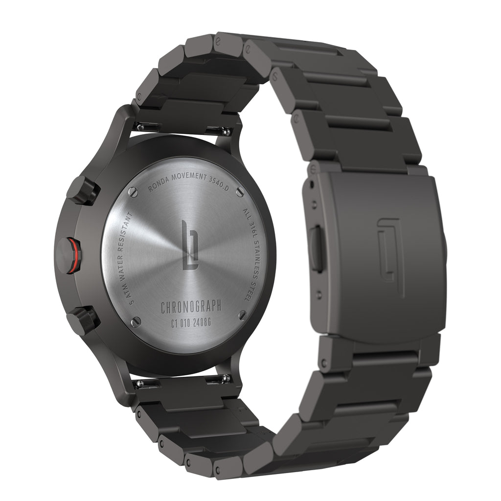 Stainless steel chronograph watch with black metal bracelet, viewed from the back