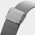 Close-up of silver mesh stainless steel watch strap with engraved clasp